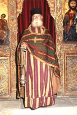 Palaichori Morphou, church of Agios Loukas, the priest Neophytos in 18th century sacerdotal costume.